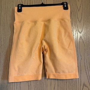 Orange biker shorts with butt scrunch